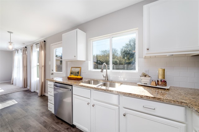 kitchen with white cabinets, sink, stainless steel dishwasher, a healthy amount of sunlight, and dark hardwood / wood-style flooring