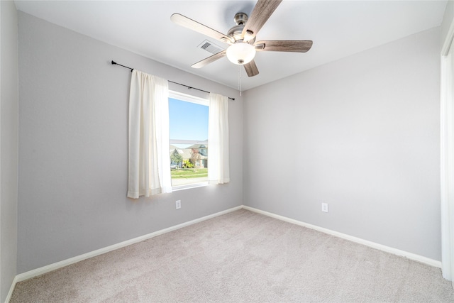 carpeted empty room with ceiling fan