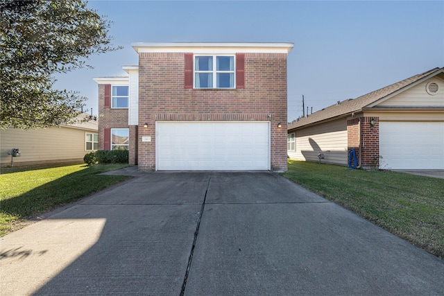 view of property with a front lawn and a garage