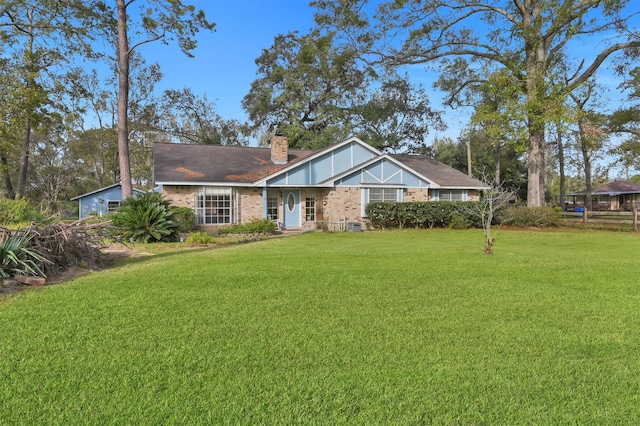 ranch-style house with a front lawn