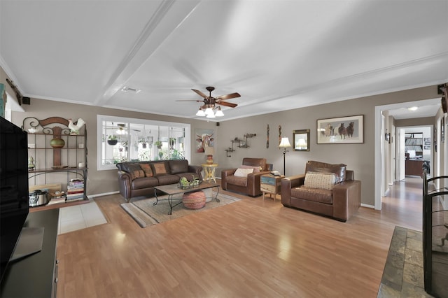 living room featuring crown molding, light hardwood / wood-style flooring, and ceiling fan