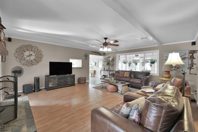 living room featuring hardwood / wood-style flooring, ceiling fan, and ornamental molding