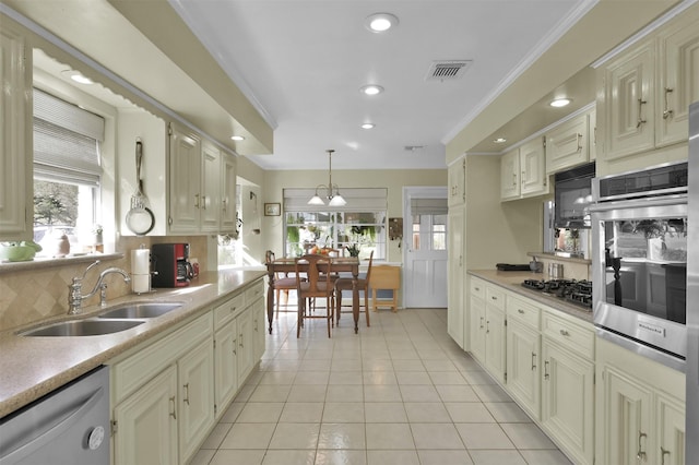 kitchen featuring sink, stainless steel appliances, backsplash, light tile patterned floors, and ornamental molding