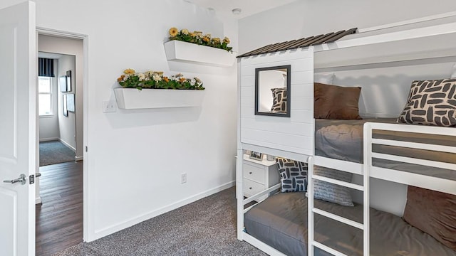 carpeted bedroom with baseboards