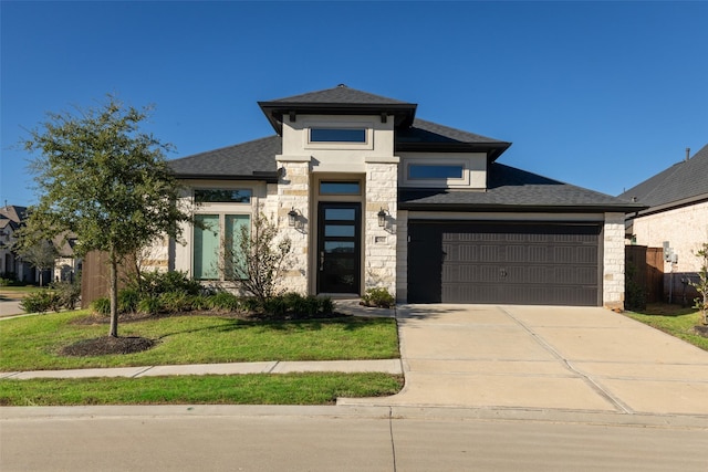 prairie-style home featuring a front lawn