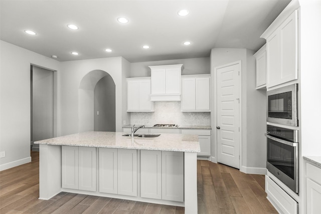 kitchen with white cabinetry, a kitchen island with sink, and appliances with stainless steel finishes