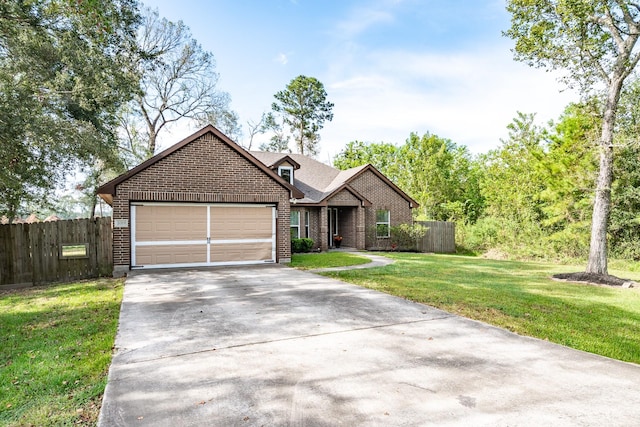 view of front facade with a front yard and a garage