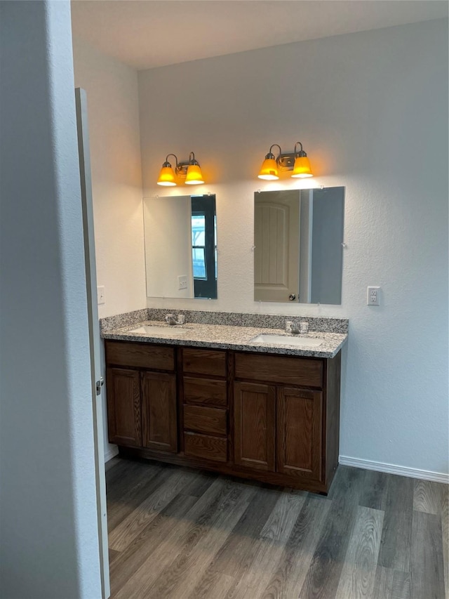 bathroom featuring vanity and hardwood / wood-style flooring