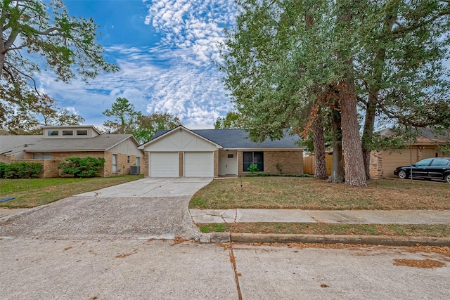 view of front of property with a front yard and a garage