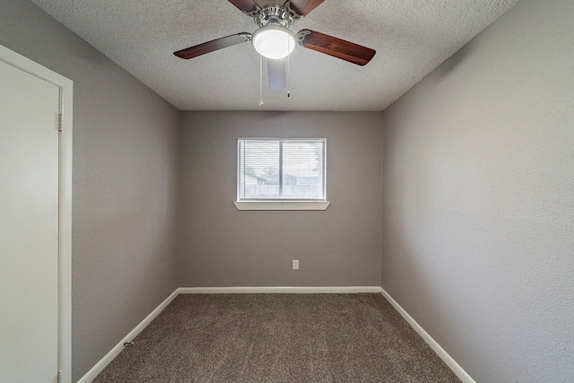 carpeted spare room with a textured ceiling and ceiling fan