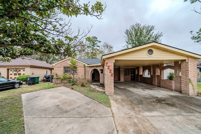 ranch-style home featuring a carport