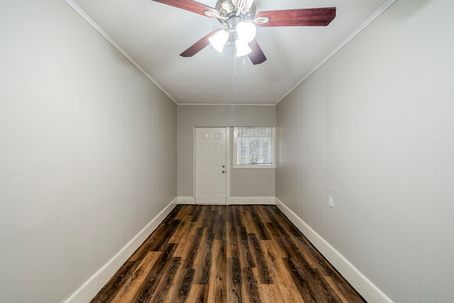 unfurnished room featuring dark hardwood / wood-style floors, ceiling fan, and ornamental molding