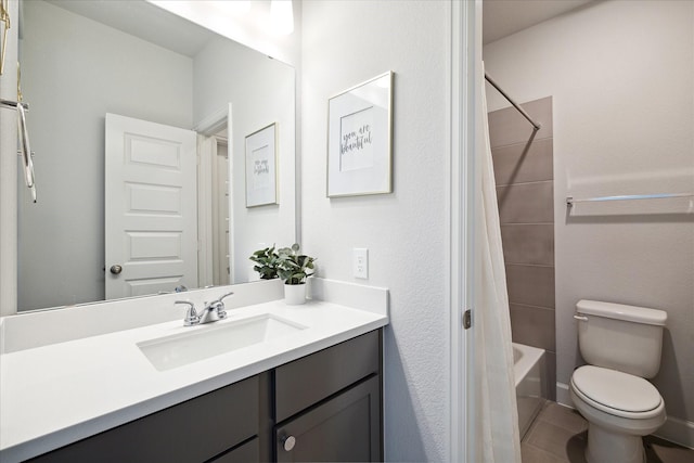 full bathroom featuring tile patterned flooring, shower / tub combo, vanity, and toilet