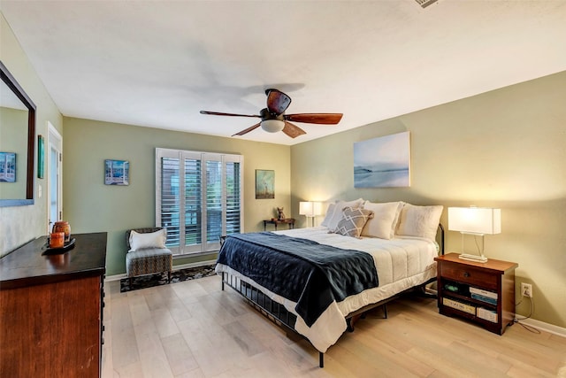 bedroom featuring ceiling fan and light hardwood / wood-style floors