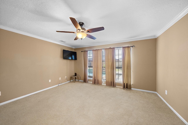 unfurnished room featuring carpet, ceiling fan, ornamental molding, and a textured ceiling