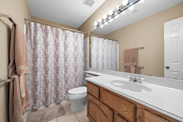 bathroom with tile patterned flooring, vanity, curtained shower, and toilet