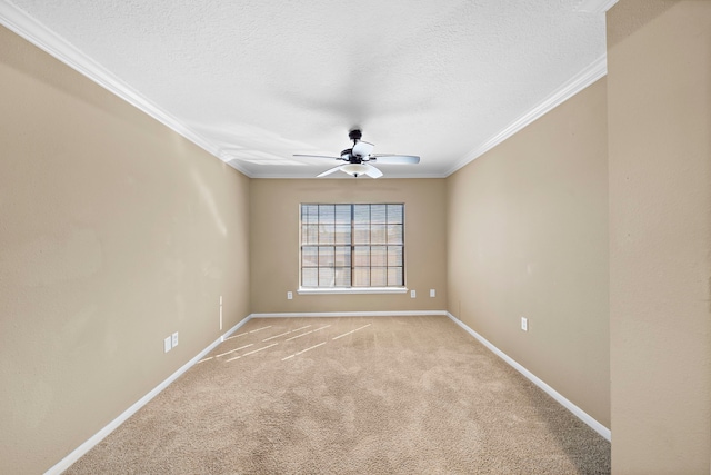 carpeted empty room with a textured ceiling, ceiling fan, and crown molding