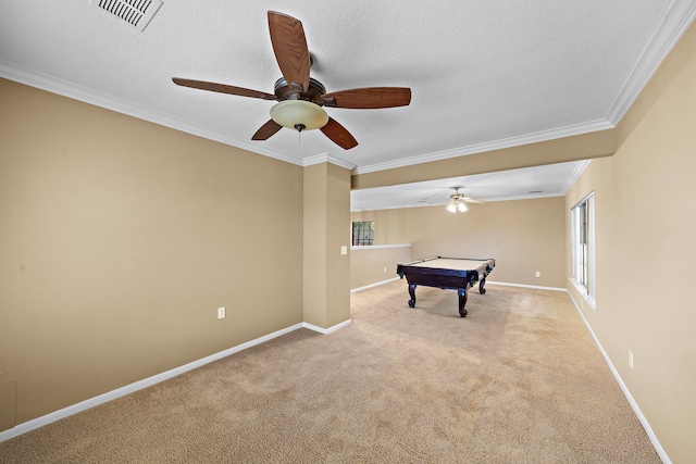 game room featuring light carpet, a textured ceiling, ceiling fan, crown molding, and billiards