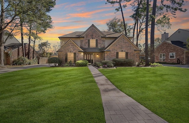 view of front of house with a yard