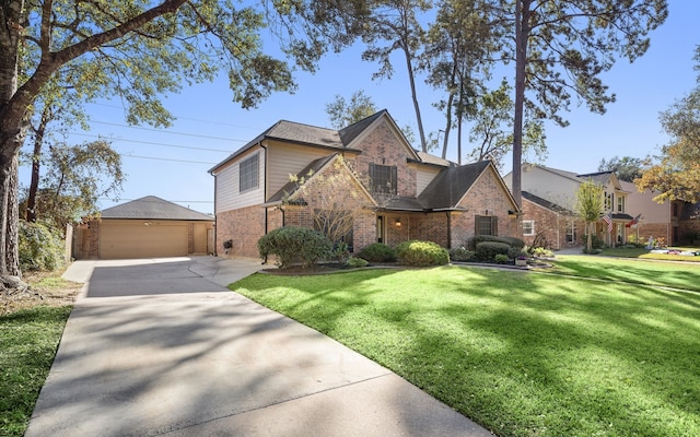 view of front of property with a garage and a front lawn