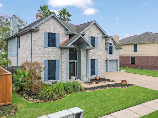 view of front of property with a front yard and a garage