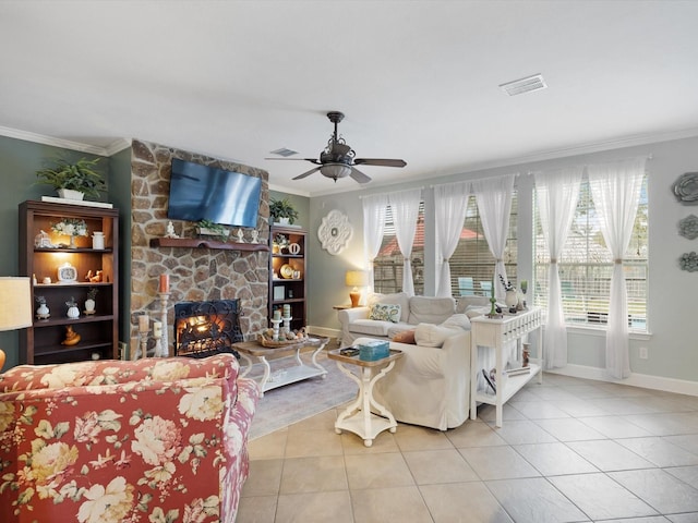 living room featuring a stone fireplace, light tile patterned floors, and crown molding