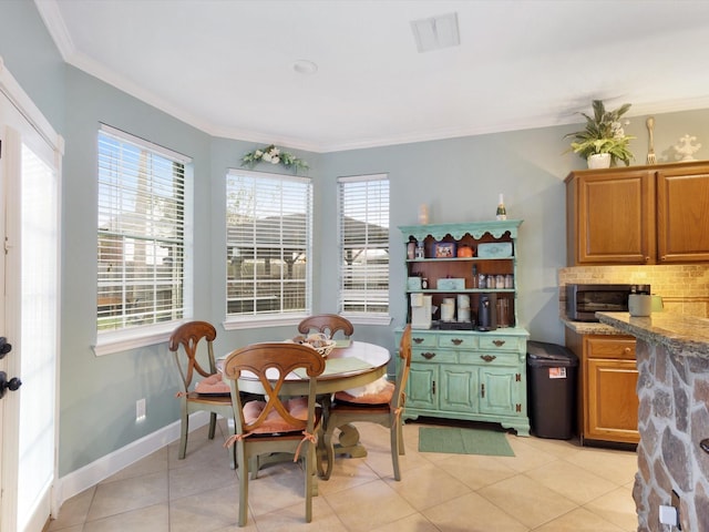 tiled dining area with ornamental molding