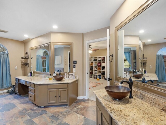 bathroom featuring vanity and ceiling fan