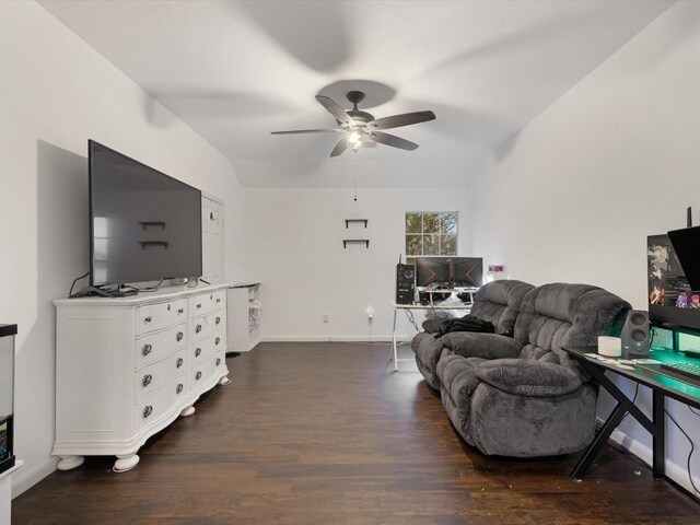 living room featuring lofted ceiling, ceiling fan, and dark wood-type flooring