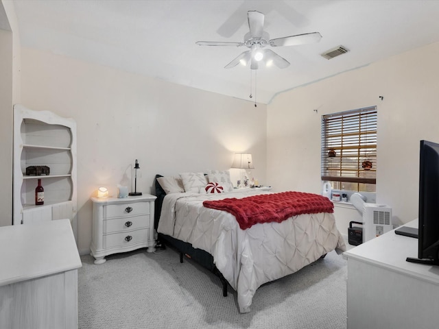 bedroom featuring ceiling fan and light carpet