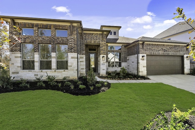 view of front of house with a garage and a front lawn