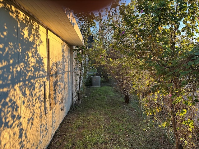 view of side of property with central AC