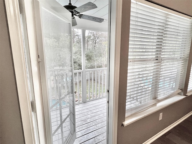 doorway to outside featuring a wealth of natural light and ceiling fan