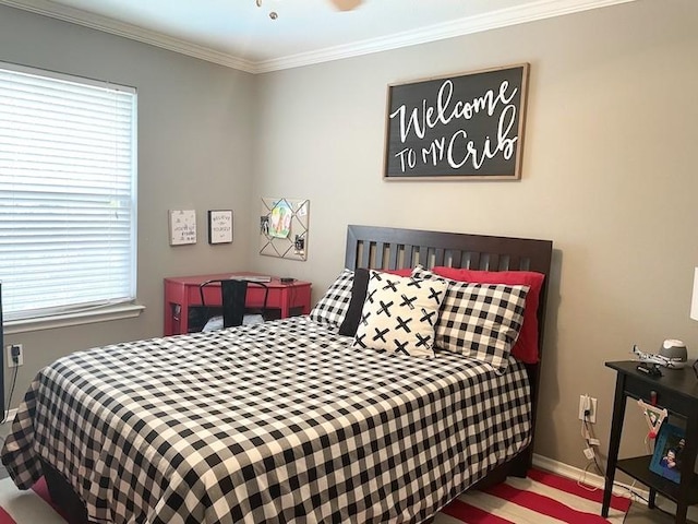 bedroom with multiple windows and crown molding