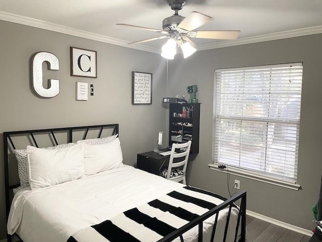 bedroom with multiple windows, ceiling fan, and ornamental molding