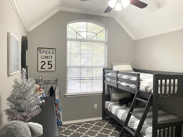 bedroom featuring multiple windows, ornamental molding, ceiling fan, and lofted ceiling