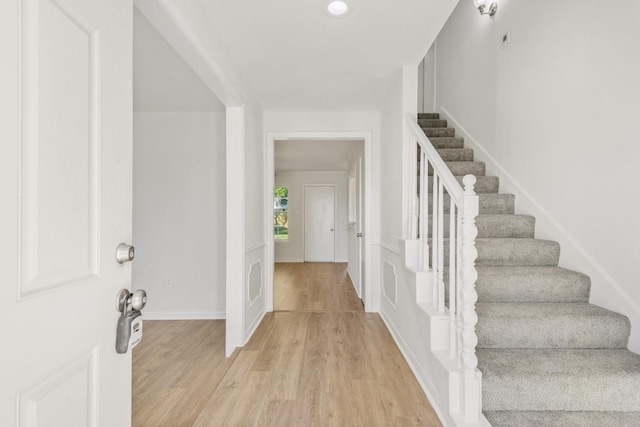 entryway with light hardwood / wood-style flooring