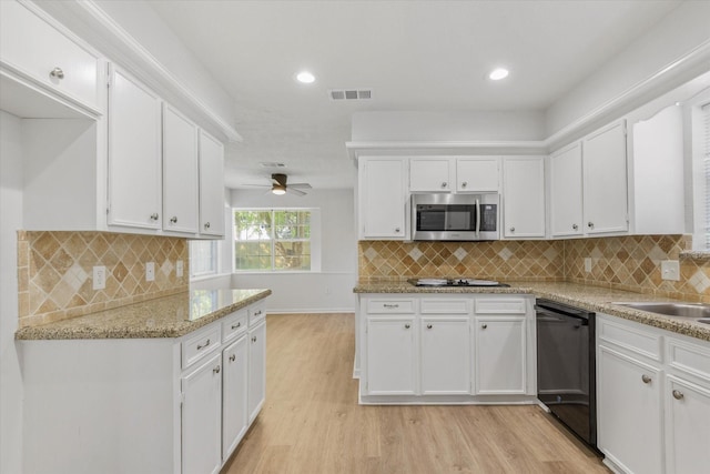 kitchen featuring light hardwood / wood-style floors, white cabinetry, ceiling fan, and black appliances