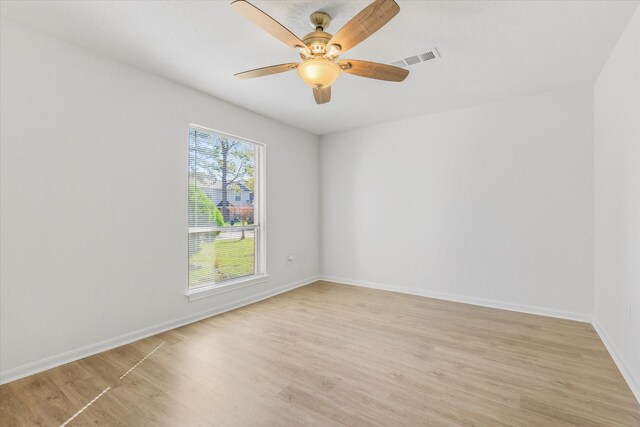 spare room featuring ceiling fan and light wood-type flooring