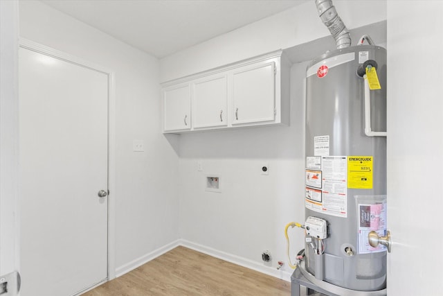 clothes washing area featuring electric dryer hookup, cabinets, gas water heater, washer hookup, and light wood-type flooring