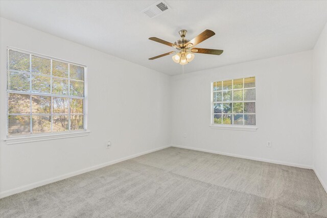 unfurnished room with light carpet and ceiling fan