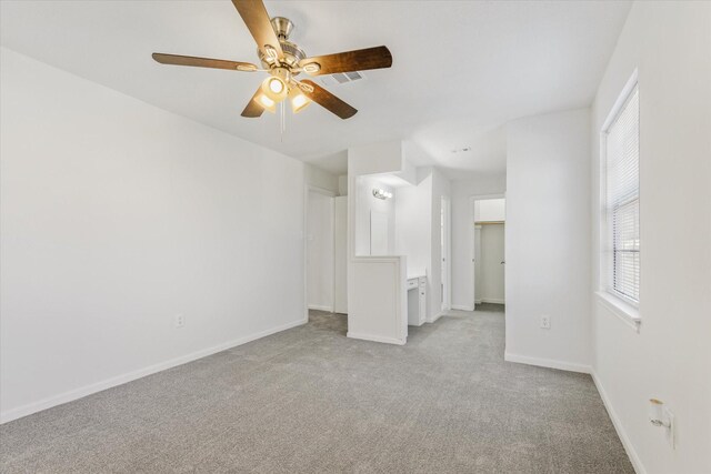 carpeted empty room with ceiling fan