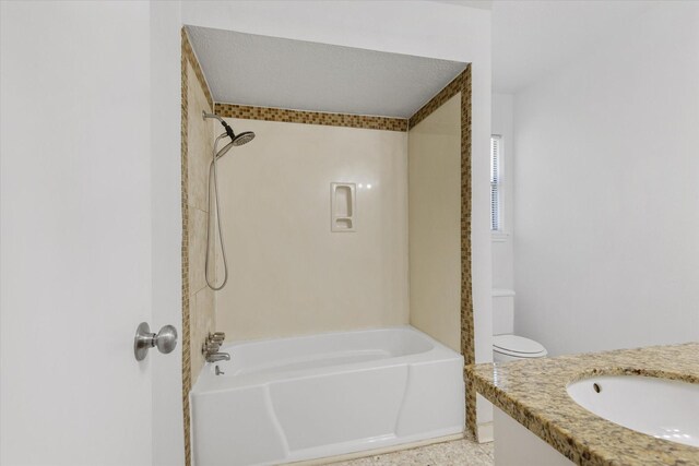 full bathroom with washtub / shower combination, vanity, a textured ceiling, and toilet