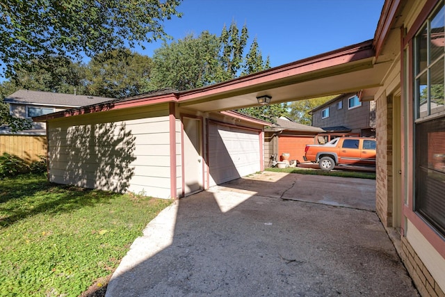 garage featuring a lawn