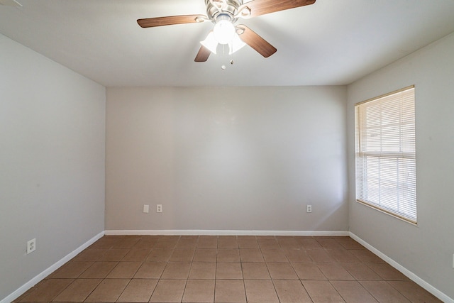 unfurnished room featuring ceiling fan and light tile patterned floors