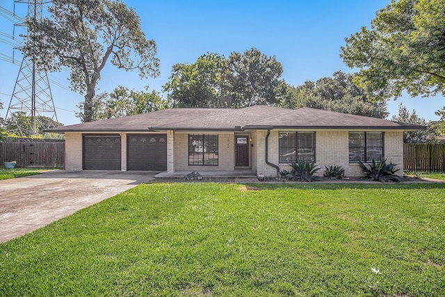 ranch-style home with a front lawn and a garage