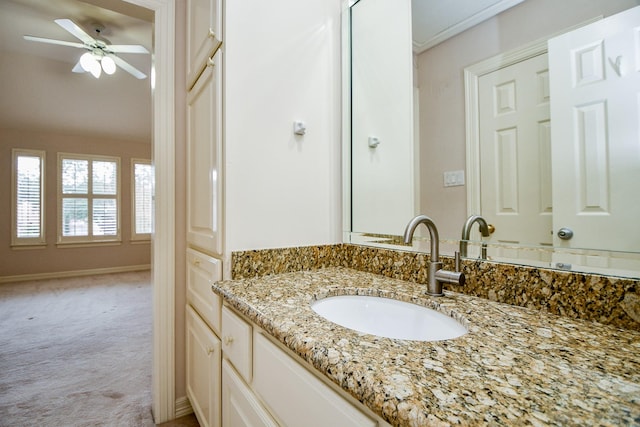 bathroom featuring ceiling fan and vanity