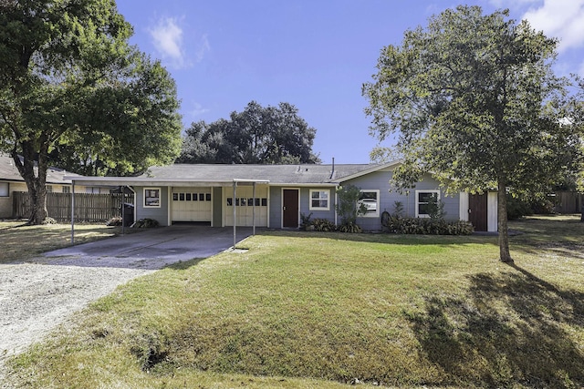 ranch-style home with a front lawn, a garage, and a carport