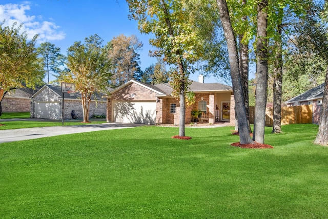 ranch-style house featuring a front yard and a garage