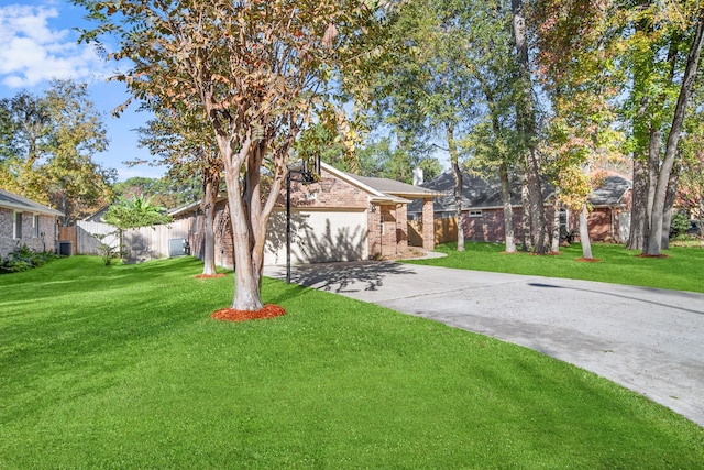 view of front of property featuring a garage and a front yard